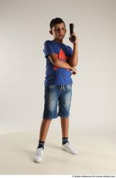 TIMBO STANDING POSE WITH GUN